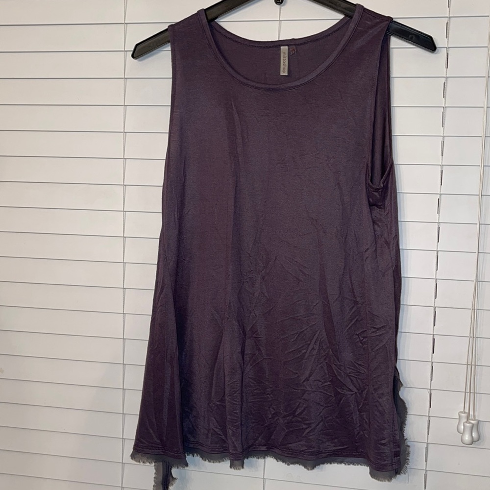 Sleeveless top with side slits